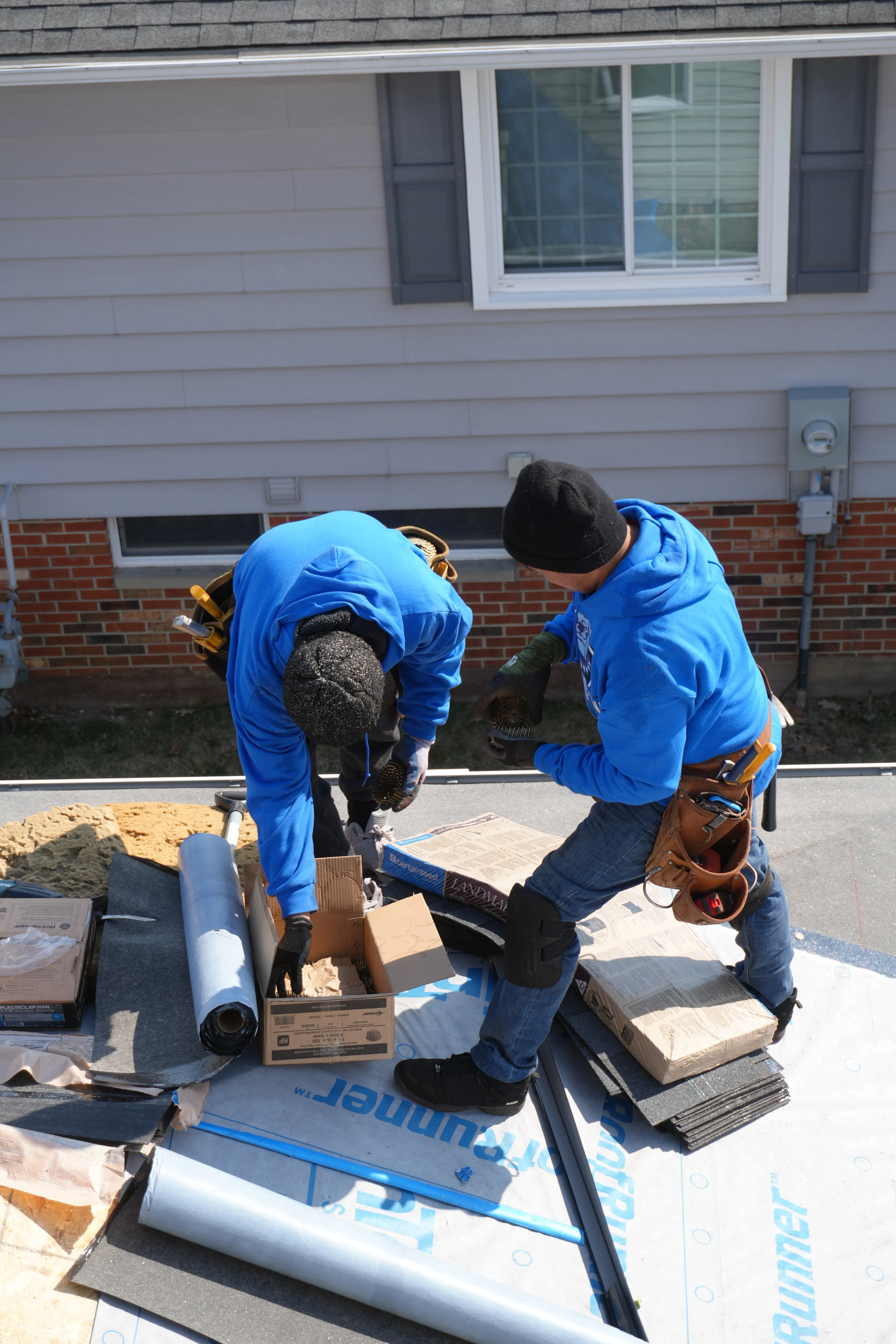 HOF Roofing crew working on a home in Massillon, Ohio