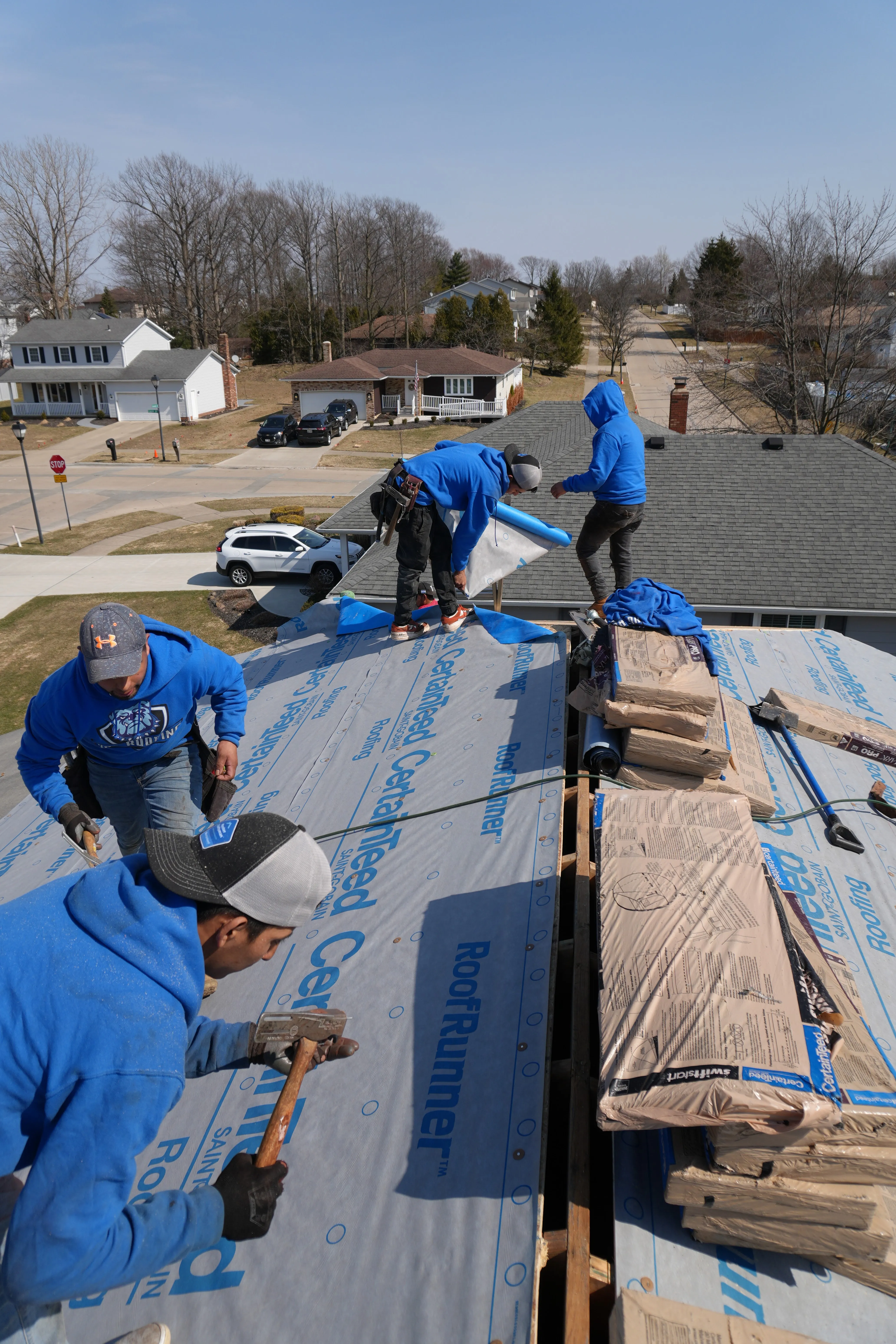 HOF Roofing crew laying underlayment during a roof repair in Ohio